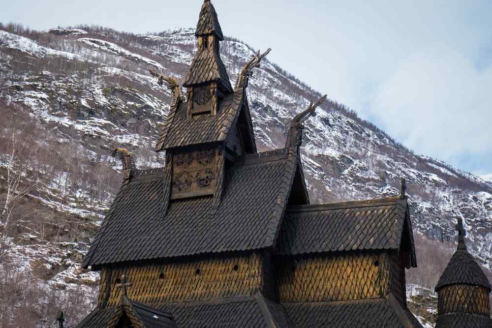 Borgund Stave Church Borgund Stave Church surrounded by snow-covered mountains in Norway.
